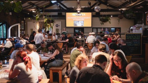 A photo of people sitting in Watershed's Cafe & Bar