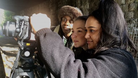 image of some Rife Magazine alumni looking into a camera