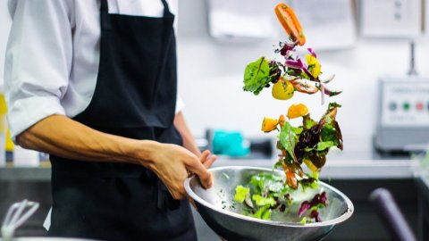 image of chef tossing a salad