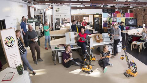 Panoramic image of Pervasive Media Studio residents in the Studio