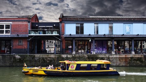 Exterior image of Watershed with boat going past