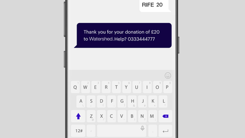 Photo of a phone with Watershed donation on screen