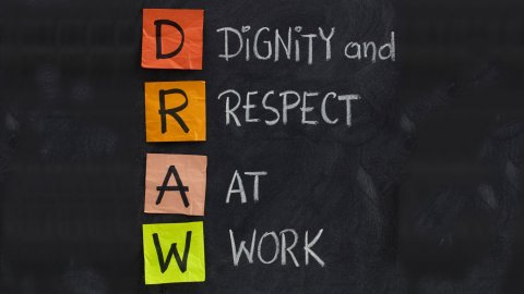 Dignity and respect at work, drawn on a blackboard