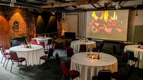 Photo of a conference room with christmas decorations and dining tables set out