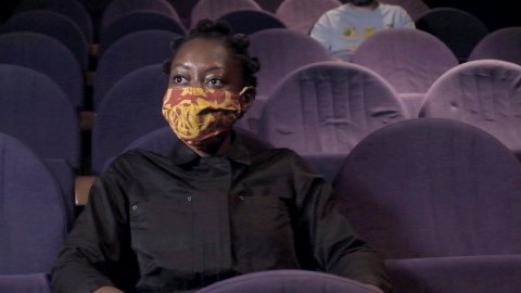 Photo of 2 customers in Watershed cinemas wearing face coverings