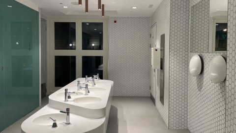 A photograph looking into to the shared wash basin area of our gender neutral toilets