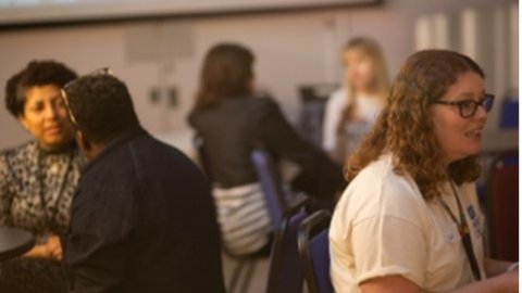 People chatting at a networking event