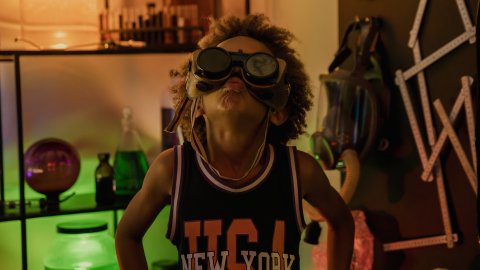 Young black child plays in the Hothouse Laboratory.