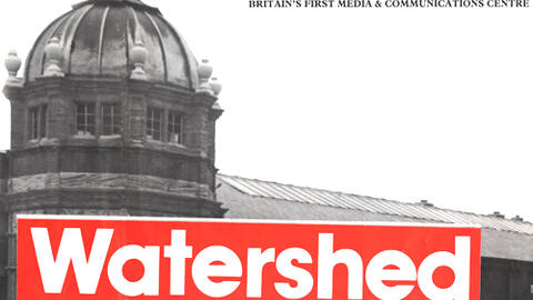 Watershed building with the date it opened across the image.