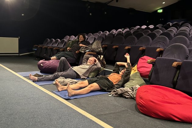 Audience members lying down in the cinema ready for a Horizonal cinema screening