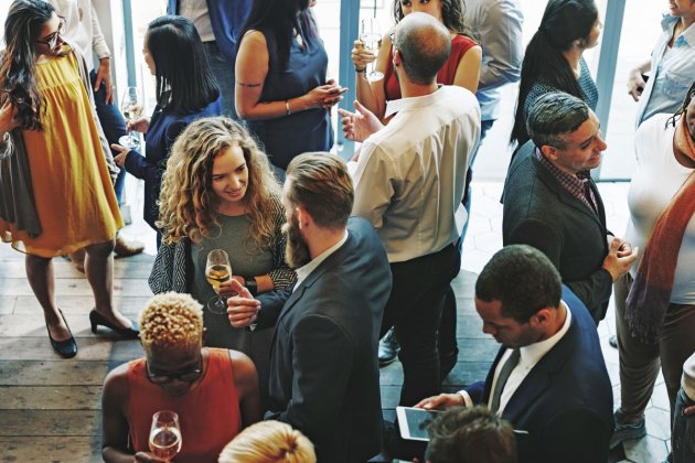 Photo of people chatting at a networking event