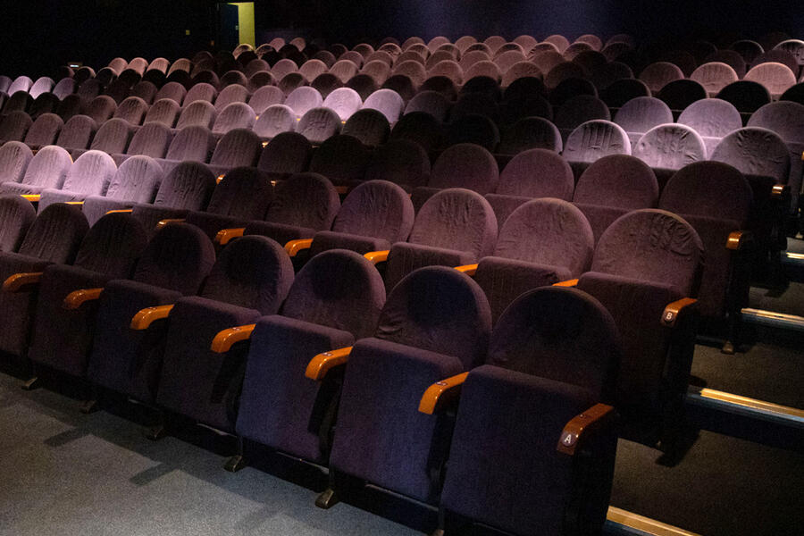 Photo of the interior of Watershed cinema 1, looking to the read of the cinema and showing raked seating 