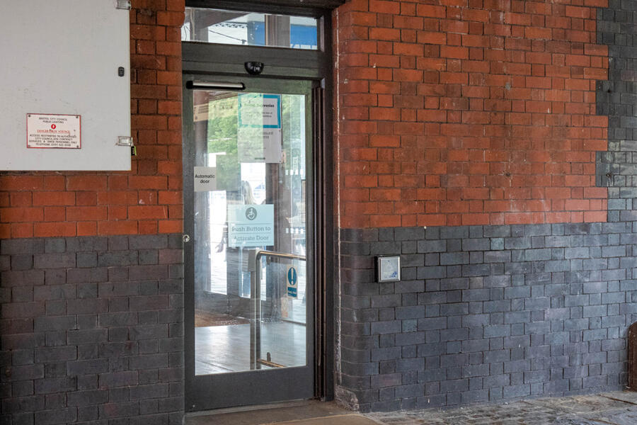 Photo of the ramped and powered door at the side entrance to Watershed