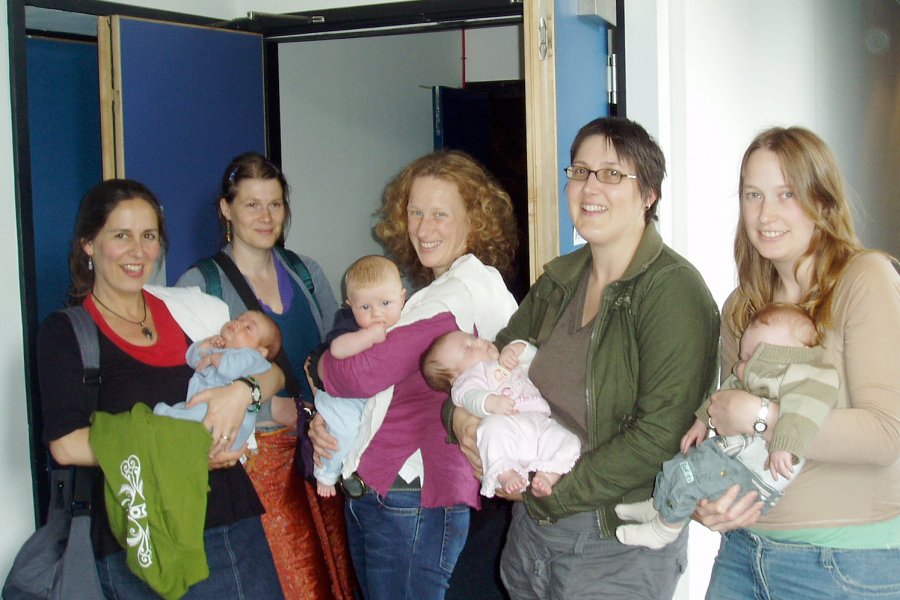 Mothers and babies standing outside a Watershed cinema, ready for a cinebabies screening