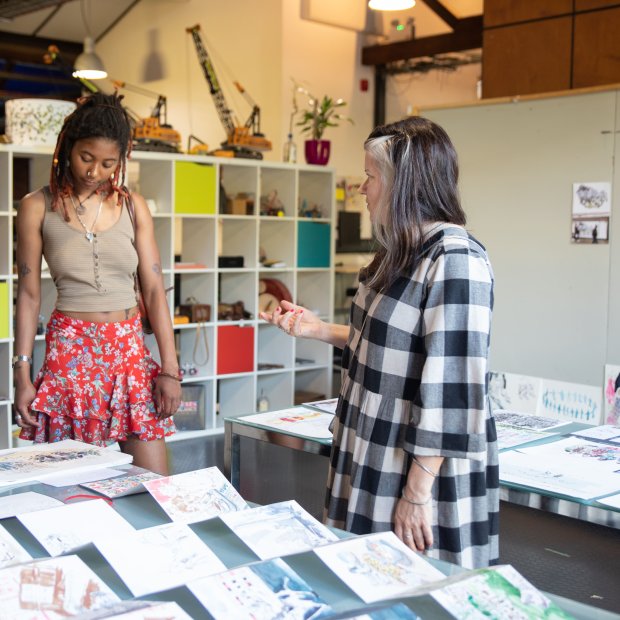 A photo of three people at First Friday in Watershed's Pervasive Media Studio.