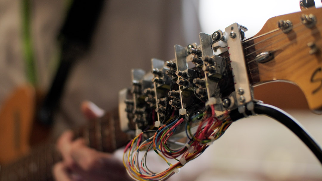 Image of solonoids on the fretboard