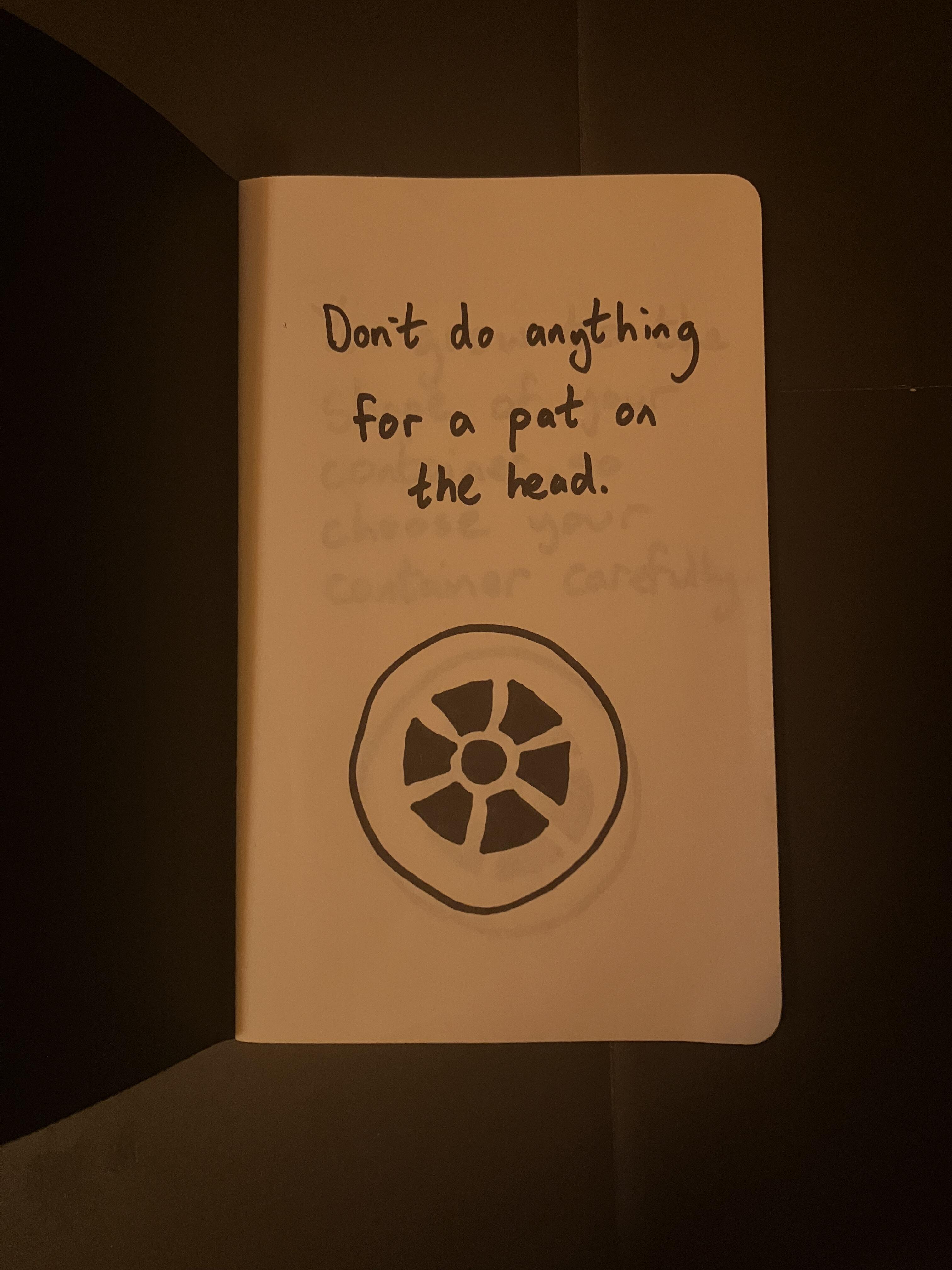 Image of notebook with writing Don't do anything for a pat on the head