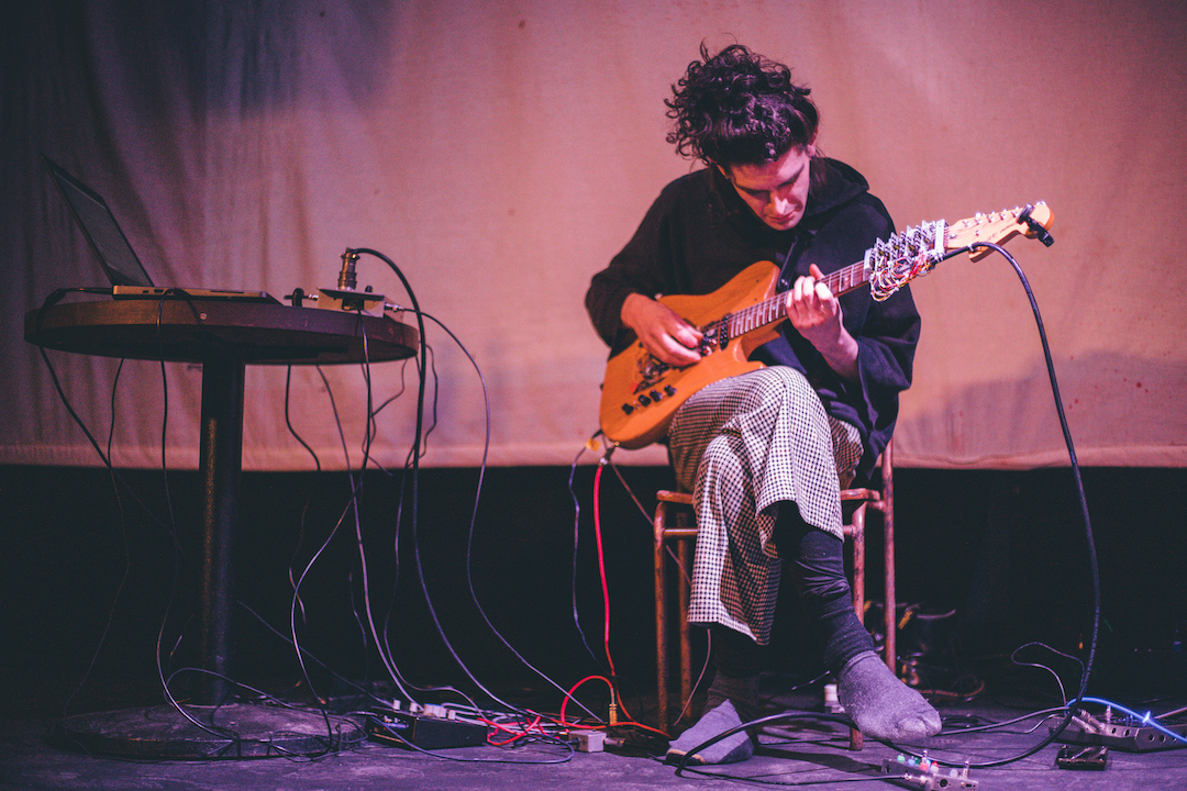 Image of Craig Scott playing the semi-automated guitar