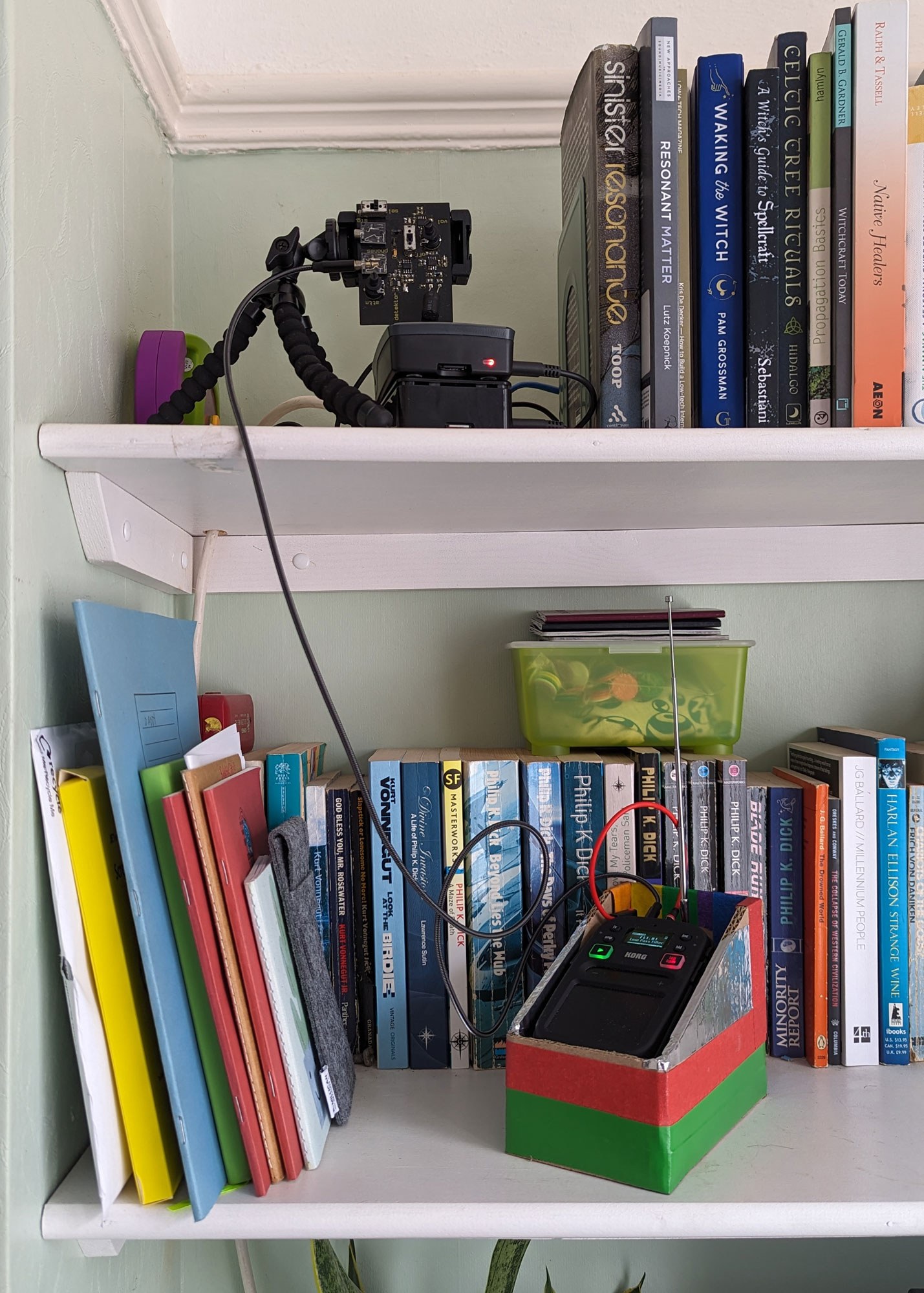 some audio equipment on a bookshelf