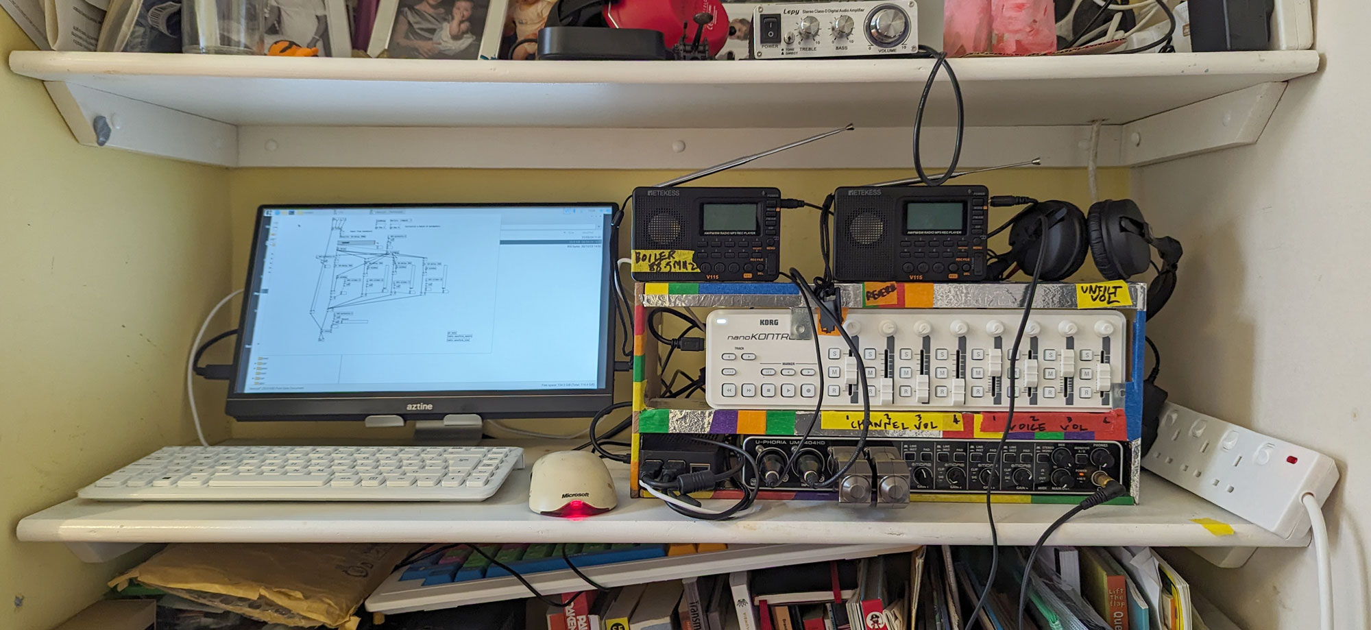 Computer and audio equipment on a shelf