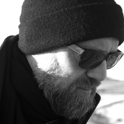 A black and white close up portrait of Duncan's profile. 