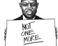 A man holds up a sign saying "NOT ONE MORE"