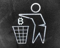 A drawing of the bitcoin logo being dropped in a rubbish bin