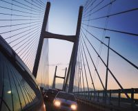 Car headlights on suspension bridge