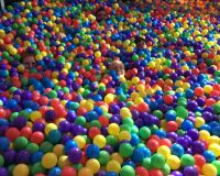 Studio team in a giant ball pit
