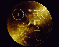 A gold disc, on a black background, etched with various symbols depicting technology, intelligence, formulae and patterns. 