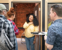 People interacting with a piece of creative tech artwork.
