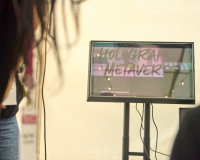A holographic display showing the text "Holographic Metaverse"