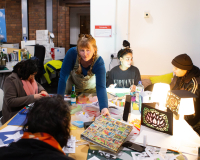 A diverse group of people are doing a Wingter Wonderland workshop.