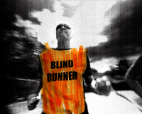 A fisheye camera angle points back at Phil, a blind runner. He wears a bright orange hi-vis tabbard with ‘blind runner’ in large capitals, dark wrap-around sunglasses and clutches a luminous yellow tether that connects him to his guide runner. The whole image is treated with a high-contrast, punk-inspired photocopy texture in black and white, with the accent colours roughly scribbled on top with a highlighter marker.