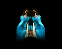 An image of the voice artist Angelica Allen. She is posing in the centre of the image, and is mirrored, creating a rorschach-test like image of two Angelicas side by side, seemingly leaning on each other. 