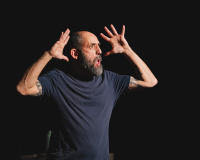 An image of the artist Jonny Cotsen mid performance. 