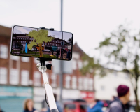 An image of a phone recording its surroundings, with the screen altering the image for the viewer. 