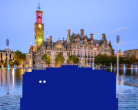 Big blue character is peering over to the left, Bradford city hall is in the background.