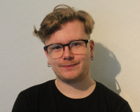 Headshot/portrait picture of Jake's face against a white background. 