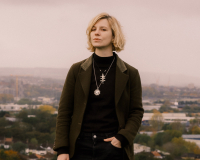 a picture of Simone on Troopers Hill in Bristol with a lovely view of houses in the distance