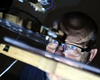 Steve Symons looking at a light synthesiser