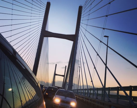 Car headlights on suspension bridge