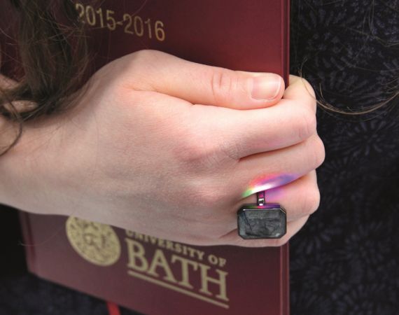 Hand with Ringly holding diary