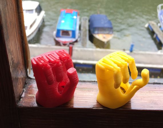 3D printed, early prototype gripping hands by Open Bionics
