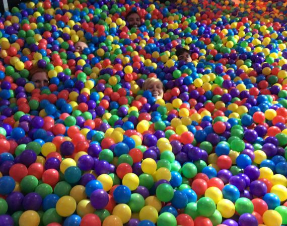 Studio team in a giant ball pit