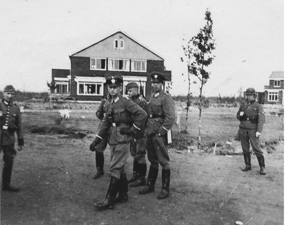 A historical image of The Commander’s House and Police Battalion Bremen members, Westerbork, NL, 02/10/1942.