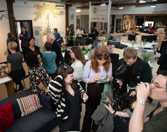 A photo of people socialising at a First Friday event in Pervasive Media Studio