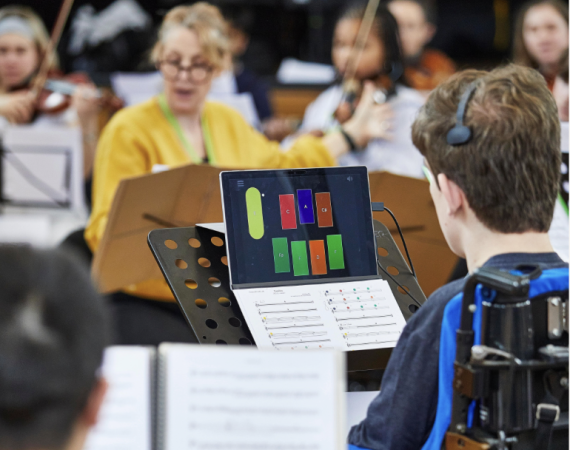 An image of an orchestra of young people with a diverse range of participants. 