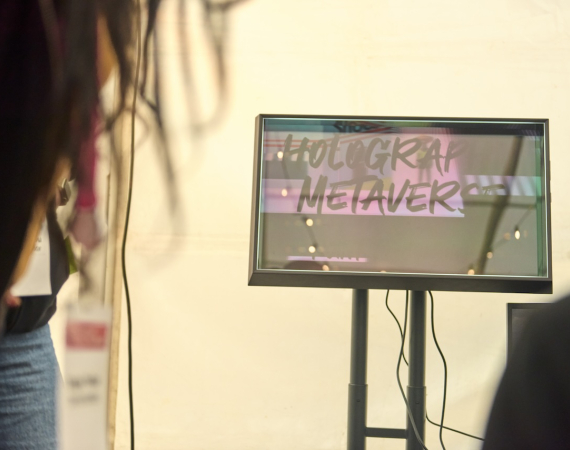 A holographic display showing the text "Holographic Metaverse"