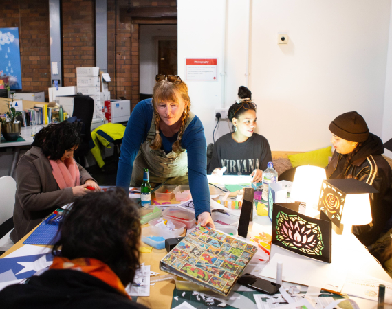 A diverse group of people are doing a Wingter Wonderland workshop.